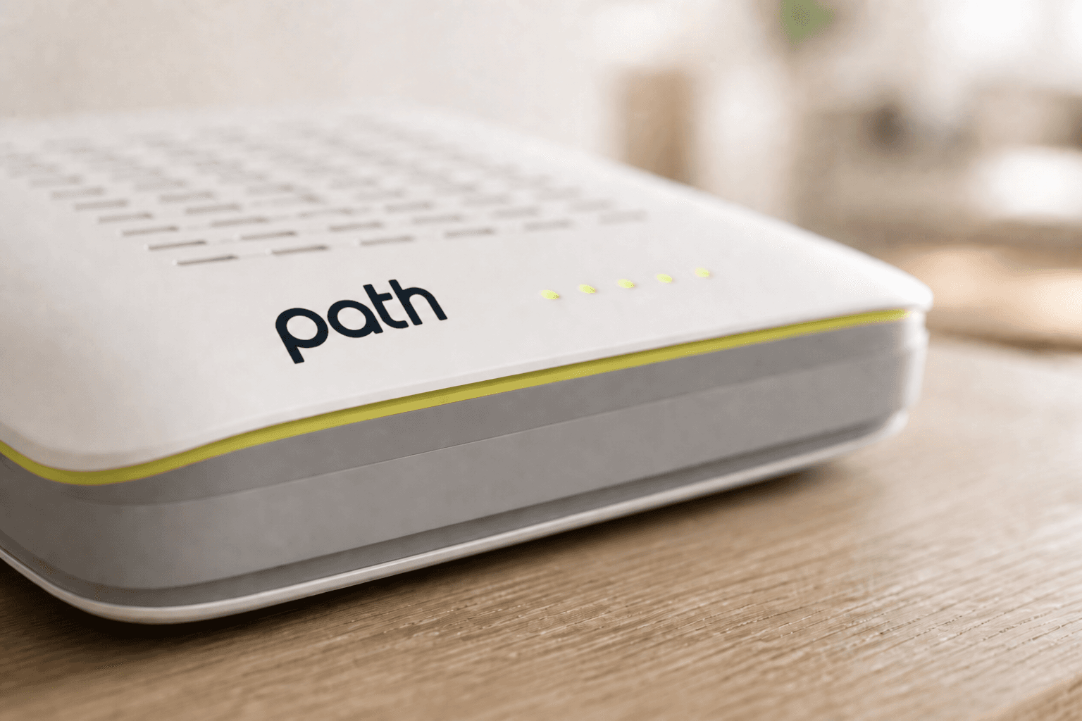 Close-up of the Path fiber ONT showing the status lights and signal accent